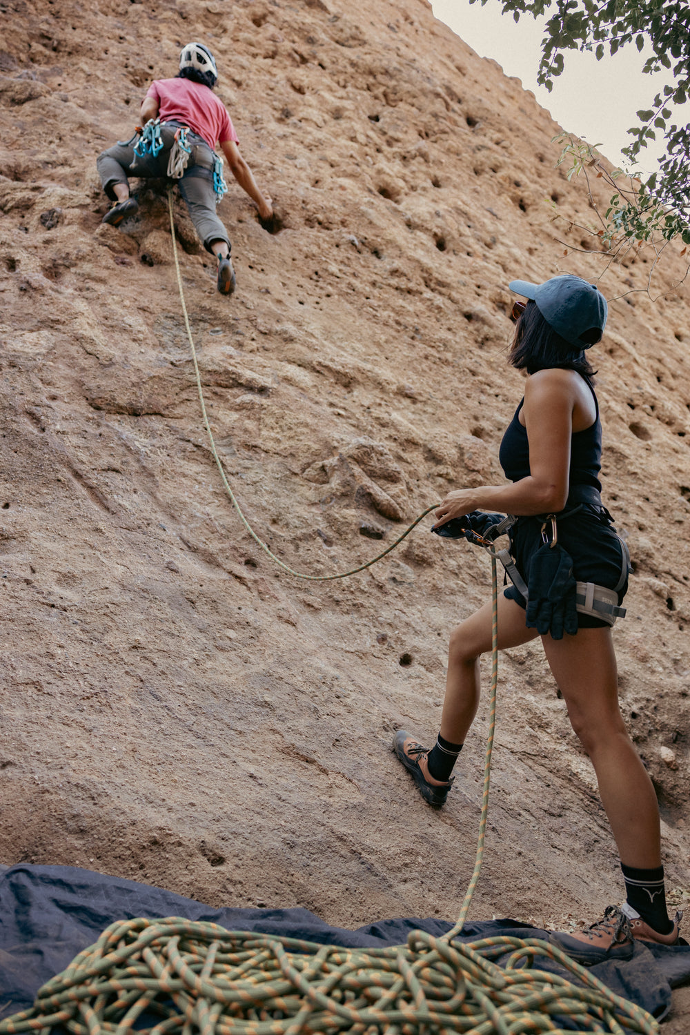 Climber and belayer wearing LONO WILD shoes outdoors