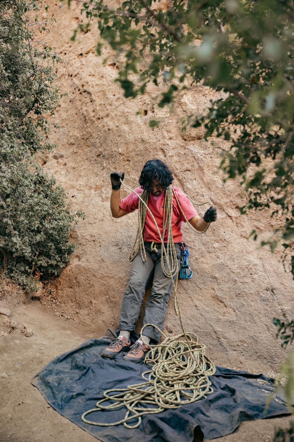 Climber handling rope while wearing LONO WILD shoes