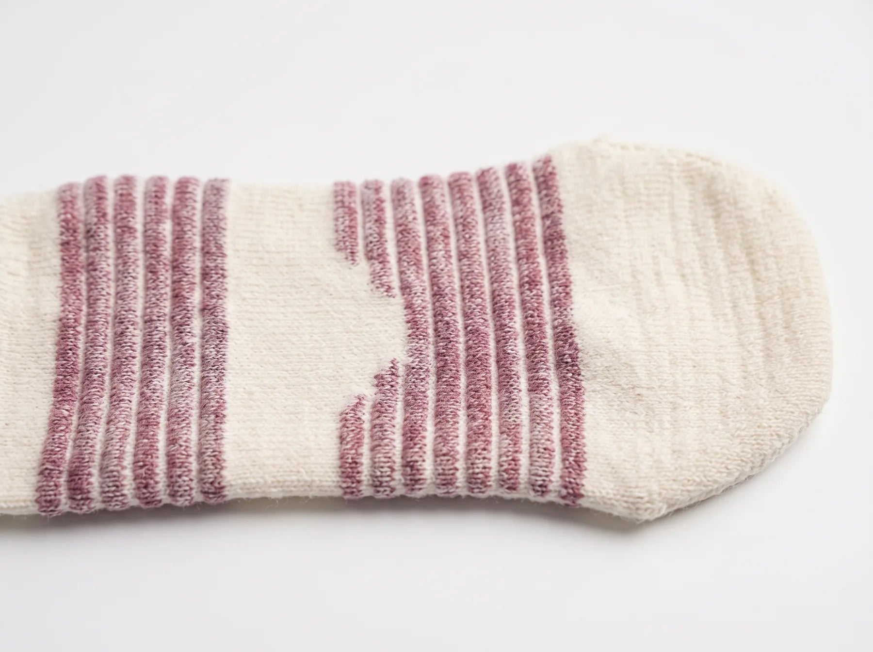 Marled stripe bands under the sole and a wide toe